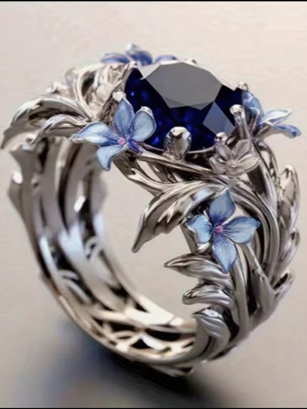 Silver Ring with Deep Blue Center and Blue Floral Accents